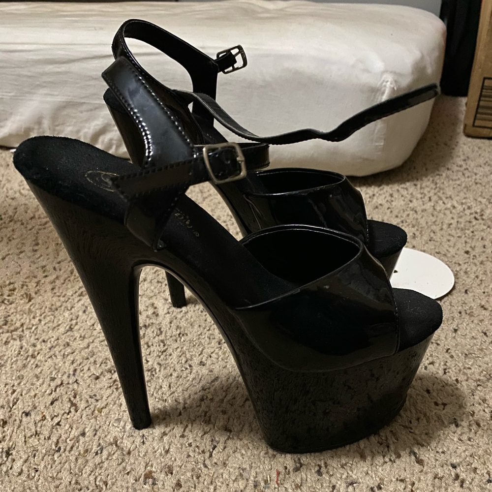 Black platform heals. Pleaser brand. Used. Still in good condition.